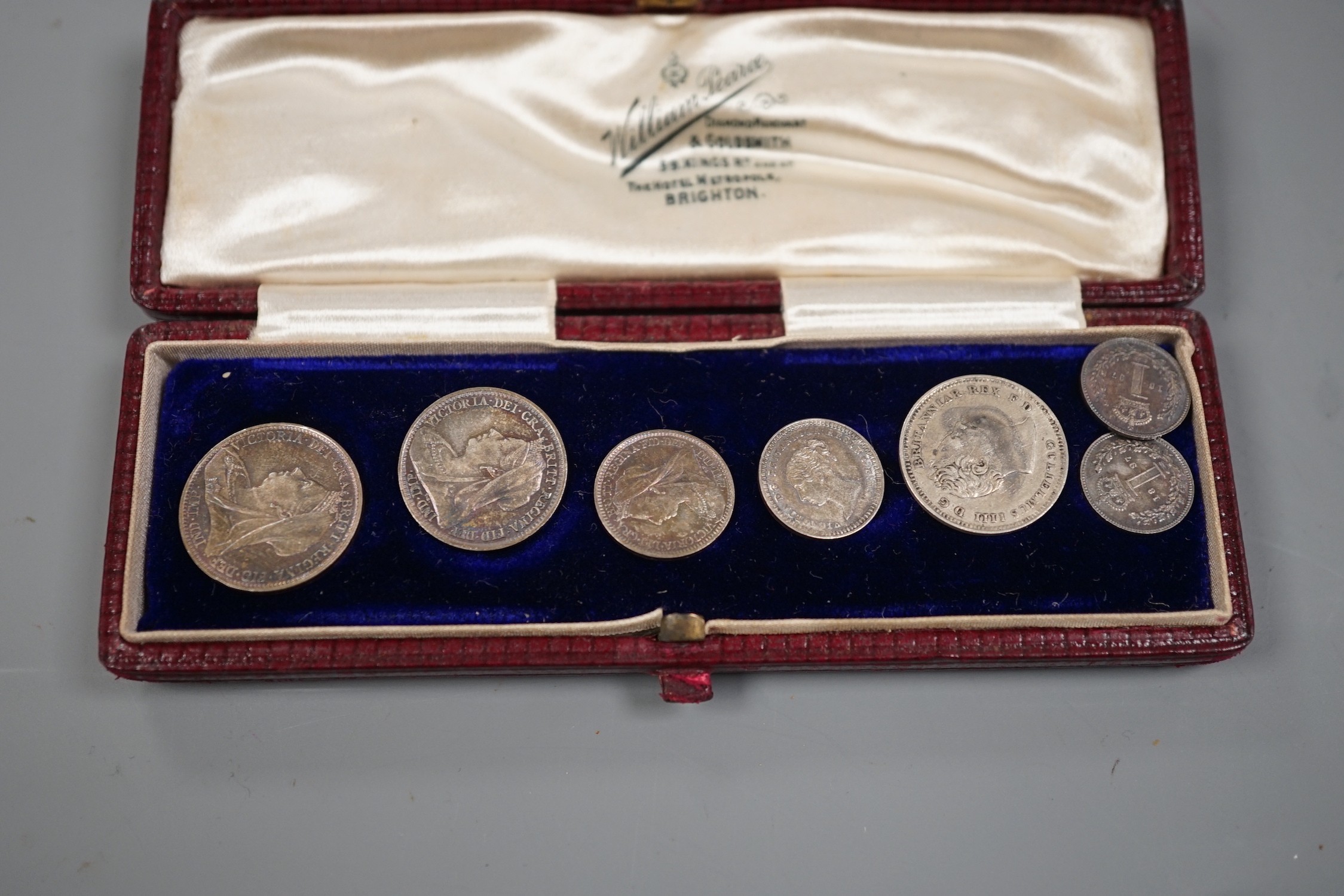 An 1897 cased maundy set and two other coins